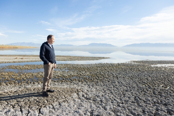 Utah State Representative Tim Hawkes stands on the shoreline of the Great Salt Lake.